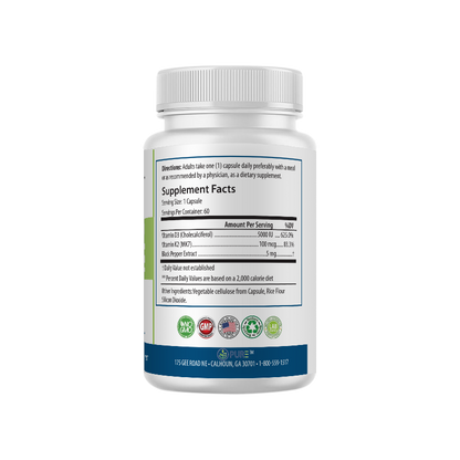Back view of PURE® D3 + K2 supplement bottle displaying Supplement Facts. The label shows each serving size is 1 capsule, with 60 servings per container. Each capsule contains 5,000 IU of Vitamin D3 (Cholecalciferol), 100 mcg of Vitamin K2 (MK7), and 5 mg of Black Pepper Extract. Additional ingredients include vegetable cellulose, rice flour, and silicon dioxide. The label also features certification icons for non-GMO, GMP, made in the USA, lab-tested, and allergen-free.