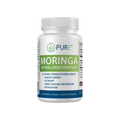 Front view of PURE® Moringa Natural Green Superfood bottle. The white label features green and blue accents, highlighting key benefits: immunity support, gut health, energy, focus, and concentration. The product contains 90 vegetable capsules and is marketed as an all-natural dietary supplement.